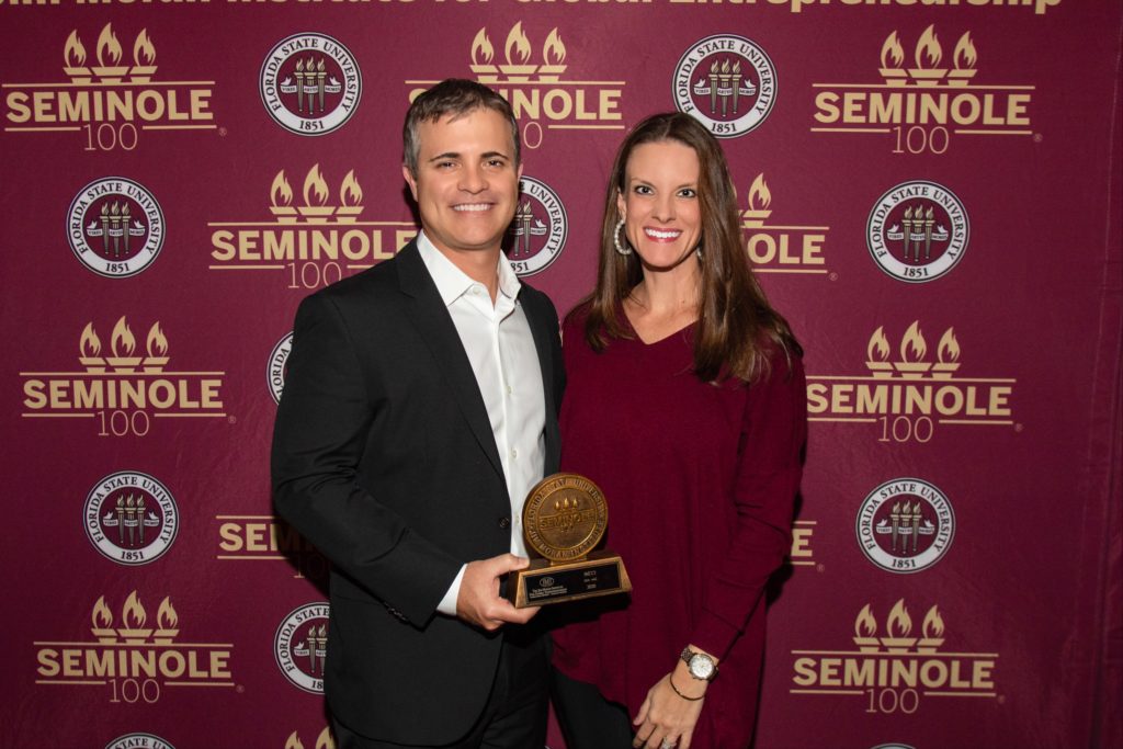 Donny and Kristen Barstow with the Seminole 100 award
