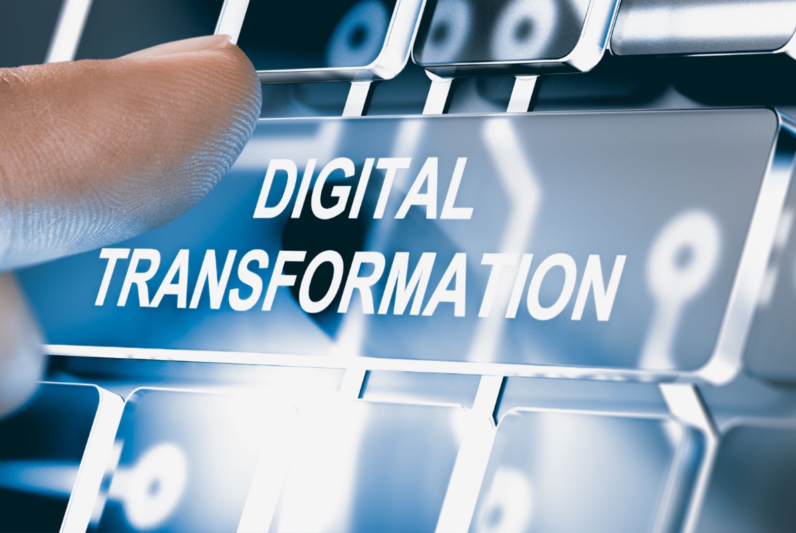 finger on keyboard button that says digital transformation
