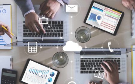 laptops on desk working on finances