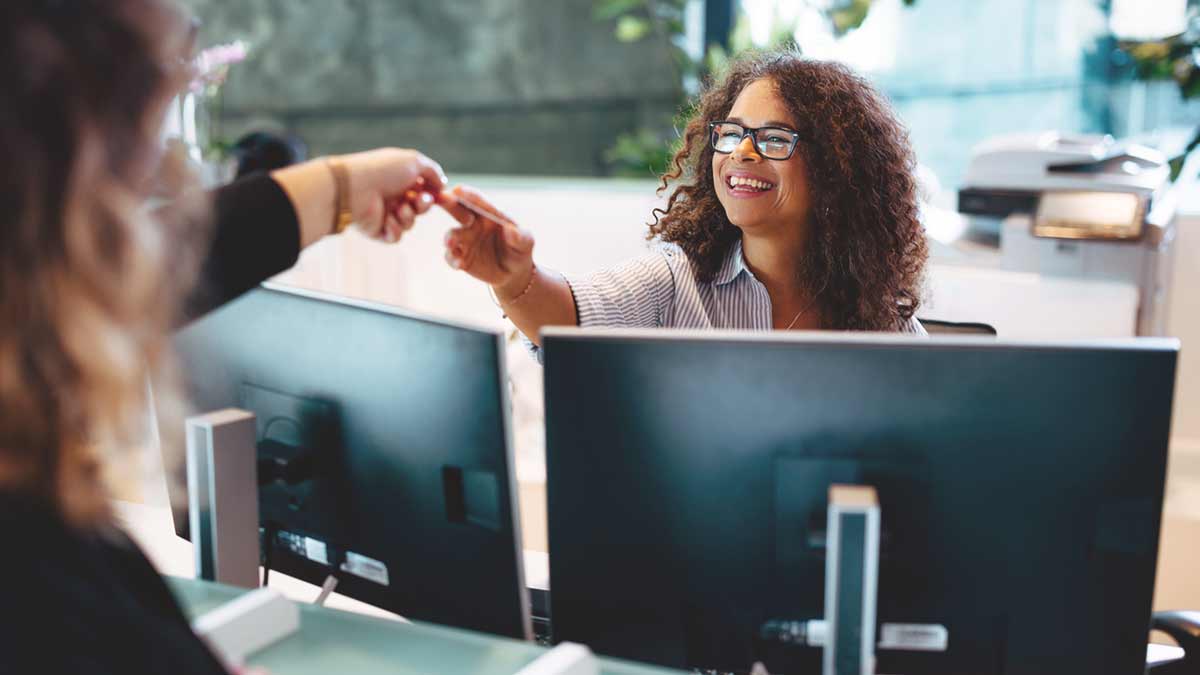 Administrator assisting a female at municipal office stock photo