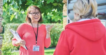 Female social counselor, health center worker, meets middle-aged woman