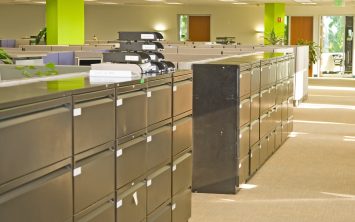 office space with file cabinets lining cubicles