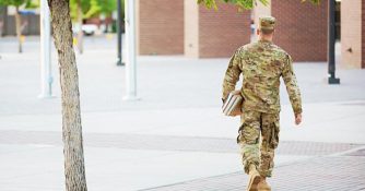 army man wearing camo uniform walking