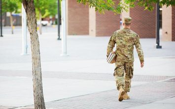 army man wearing camo uniform walking