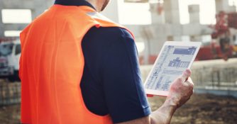 permit tech with tablet