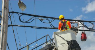 utility employee in bucket truck