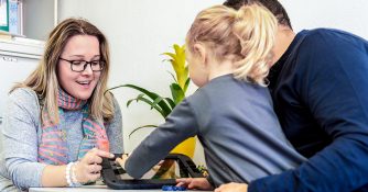 worker with family using tablet